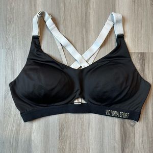 Victoria Sport black sports bra with metallic straps.